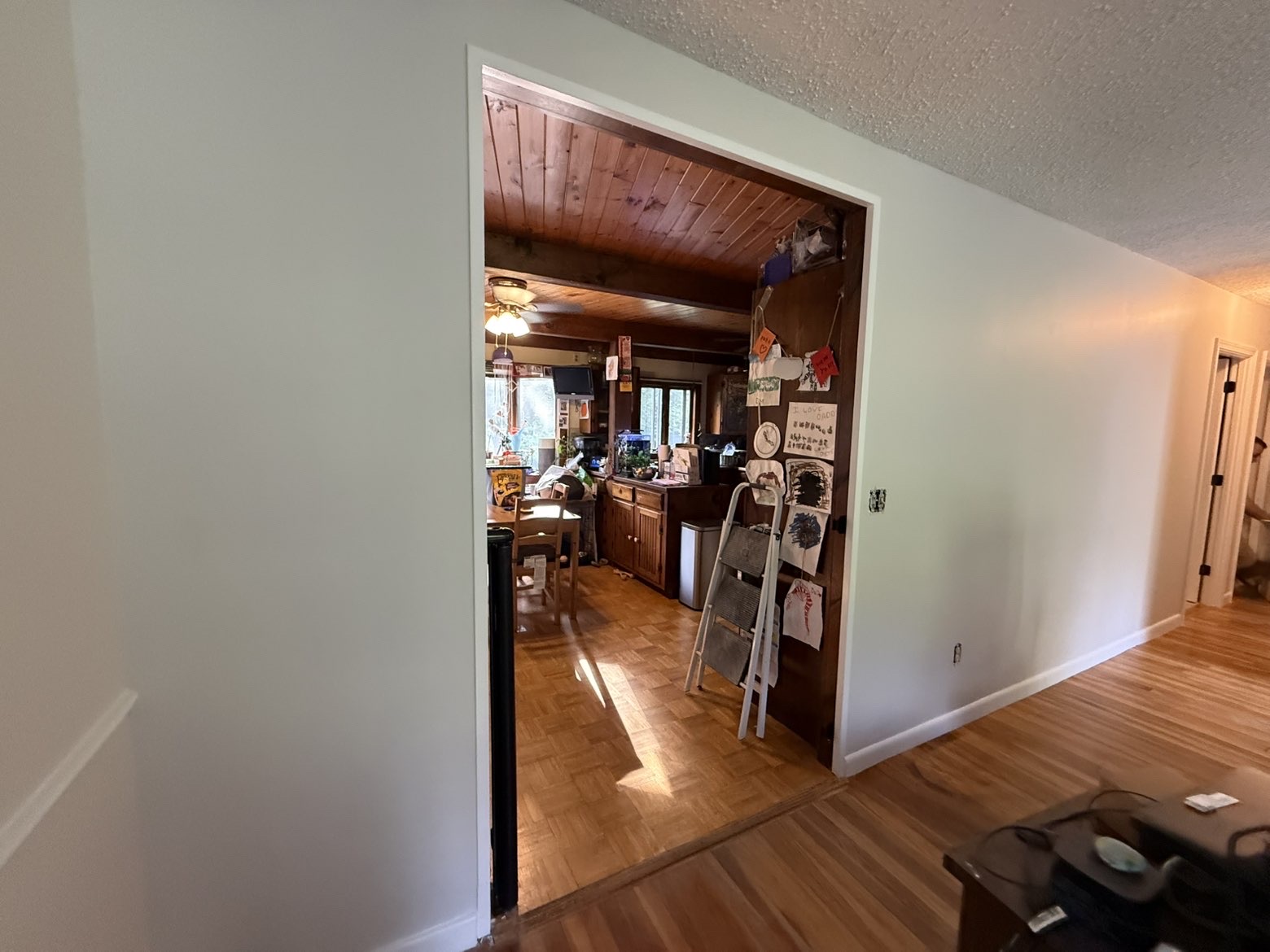 Interior doorway with clean two-tone walls & sharp trim lines
