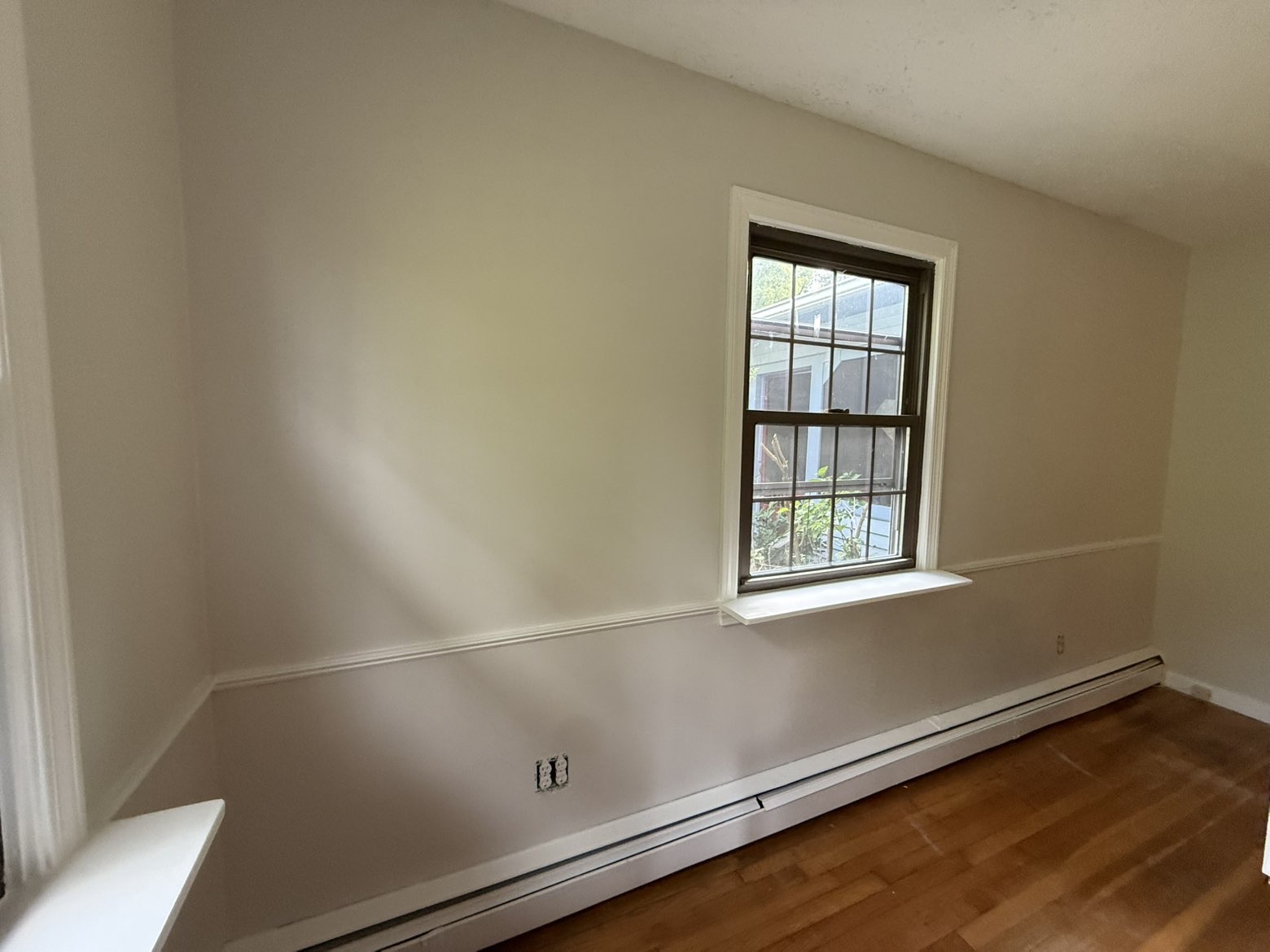 Bedroom repaint with warm walls & freshly coated trim