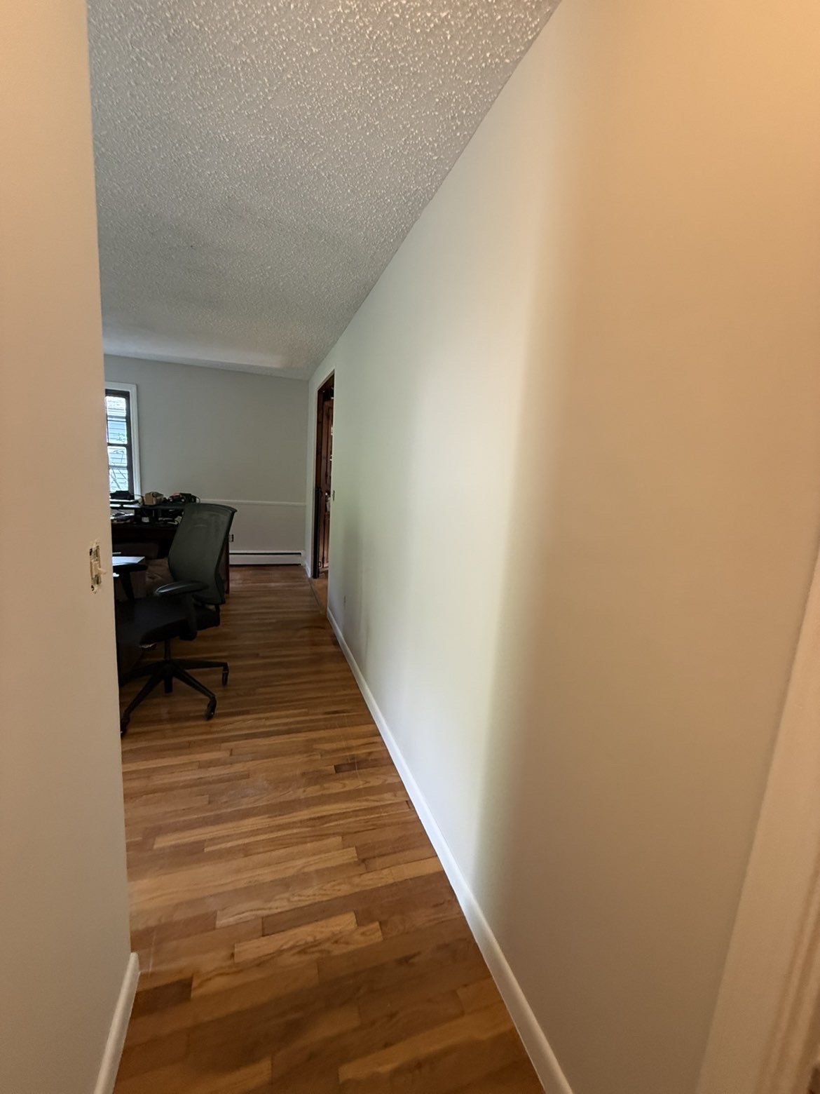 Home office hallway with soft neutral walls & clean edges