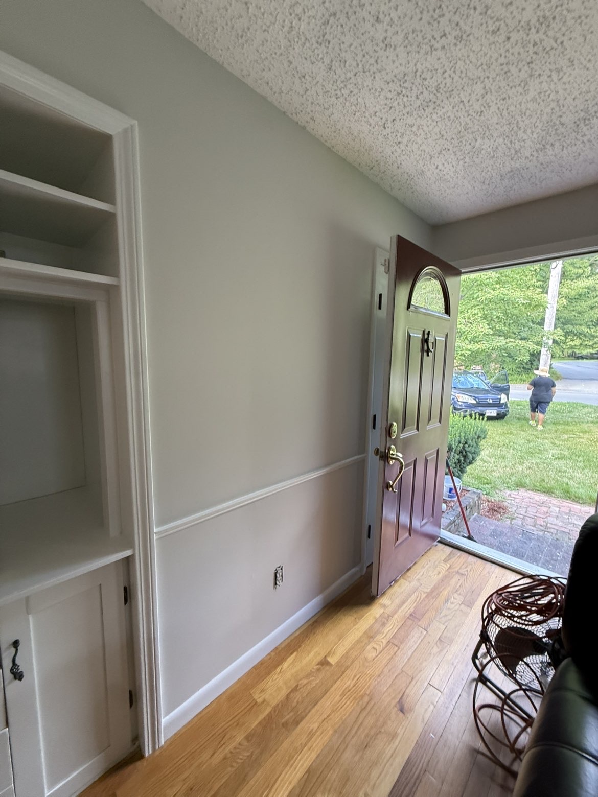 Freshly painted entryway with built-in shelving & warm neutral walls