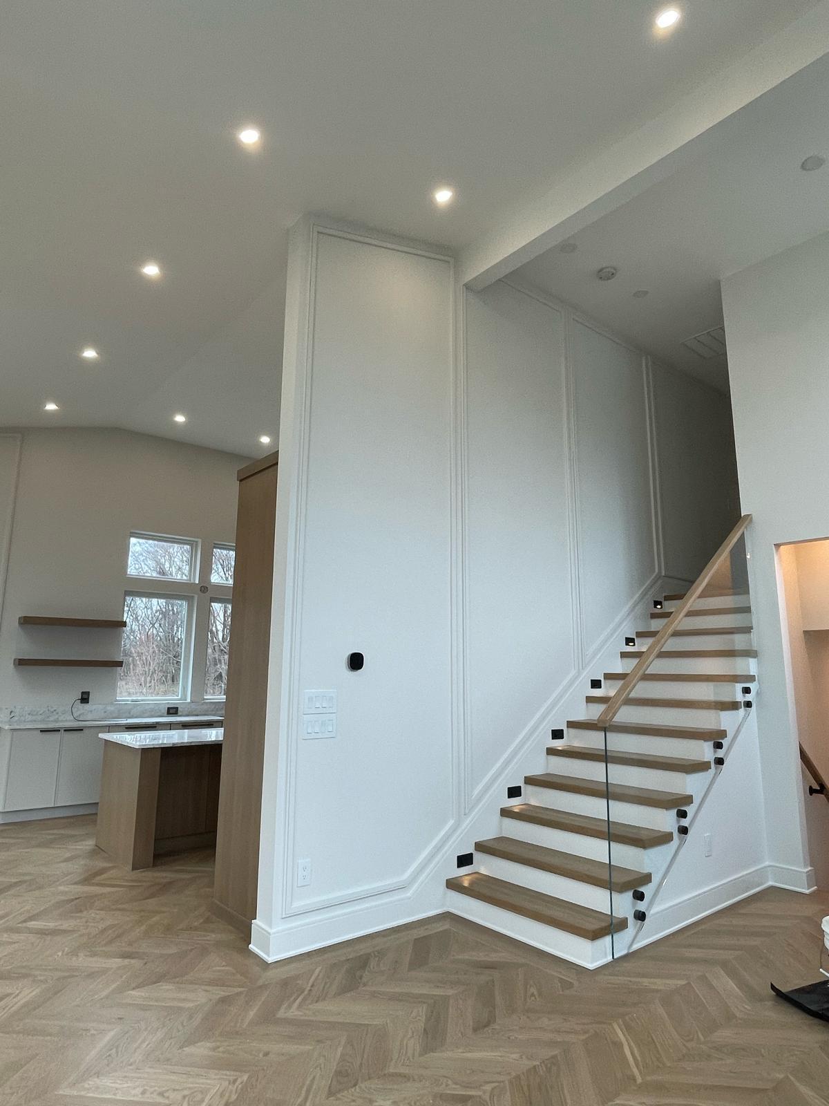 Custom wainscoting & floating stair detail